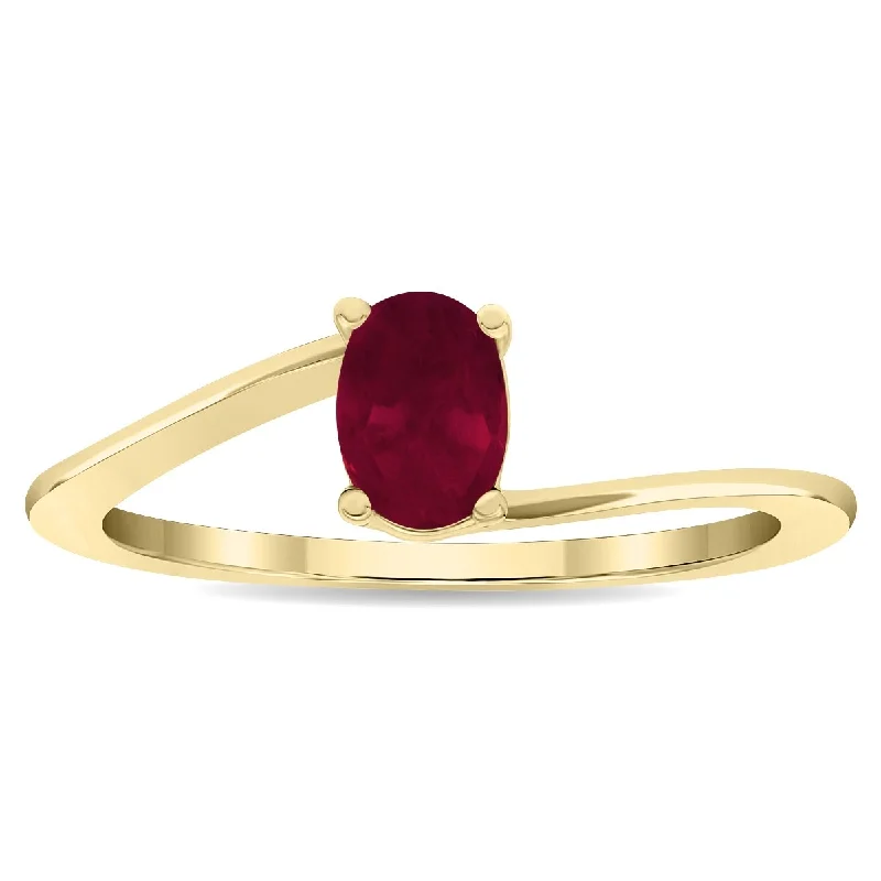 Women's Solitaire Oval Shaped Ruby Wave Ring in 10K Yellow Gold